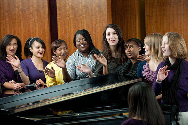 a diverse group of young adults singing in church. buy credits